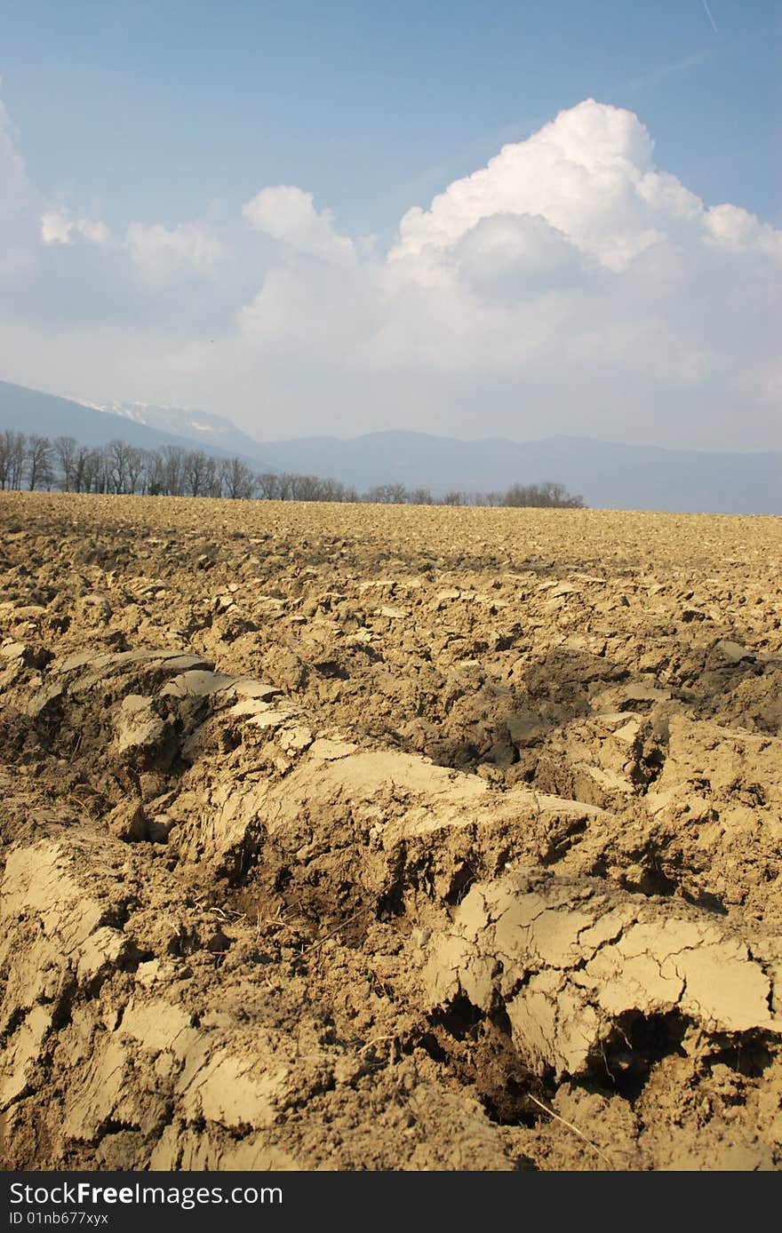 Field tillage diminishing to horizon, with farm houses. Field tillage diminishing to horizon, with farm houses.