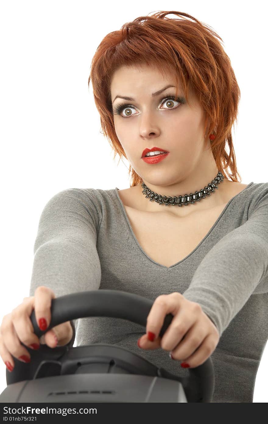 Portrait of the scared woman holding a wheel, isolated. Portrait of the scared woman holding a wheel, isolated