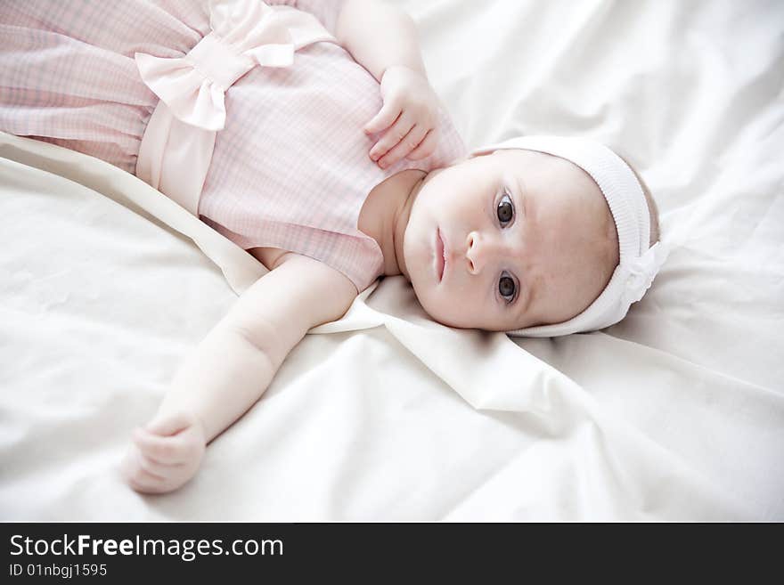 Beautiful newborn girl in beautiful pink dress