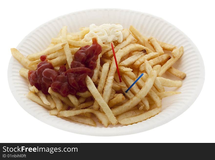 Pommes frites with ketchup and mayonnaise on paper plates