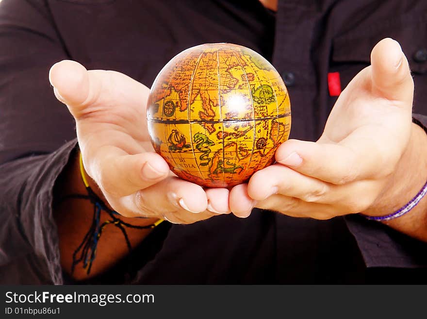 Hands with world on black dress background