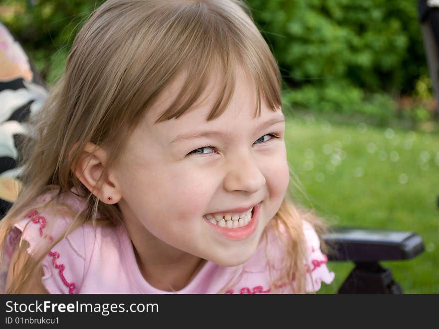 Artfully smiling little girl with a bang. Artfully smiling little girl with a bang.