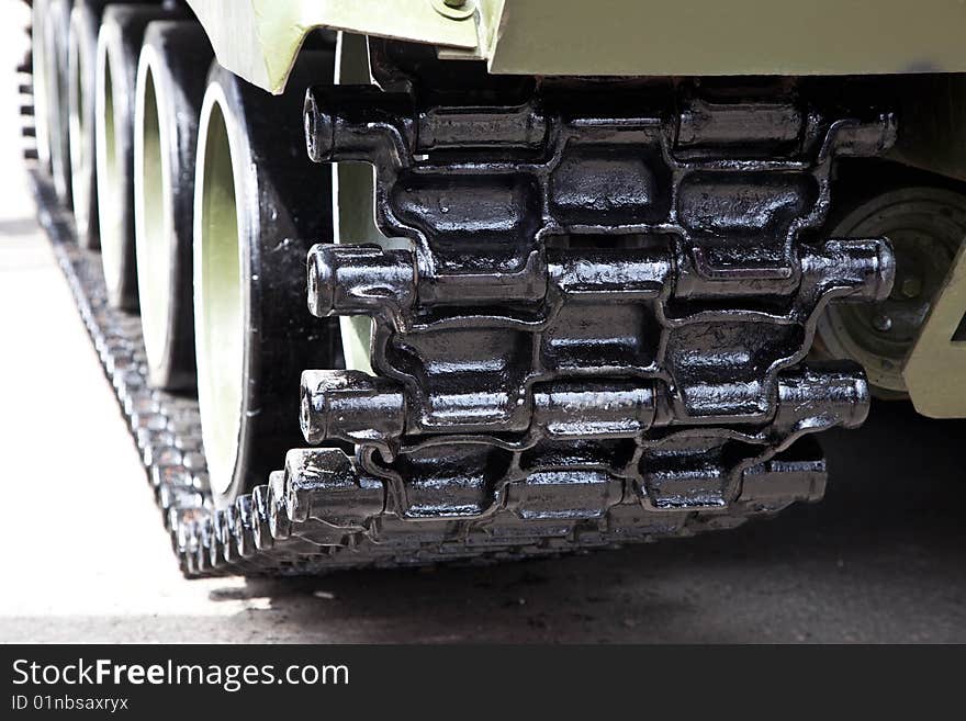 Caterpillar of the tank standing on asphalt. Caterpillar of the tank standing on asphalt