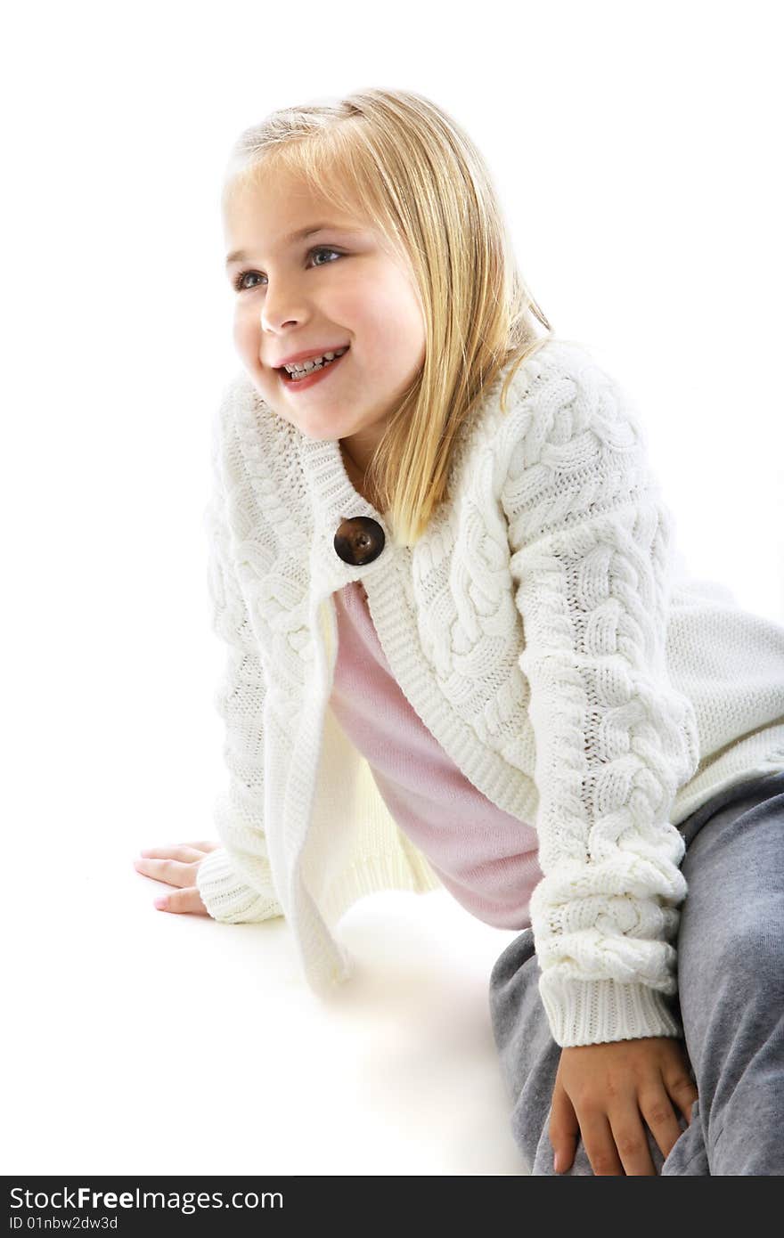 Cute little girl wearing a white sweater