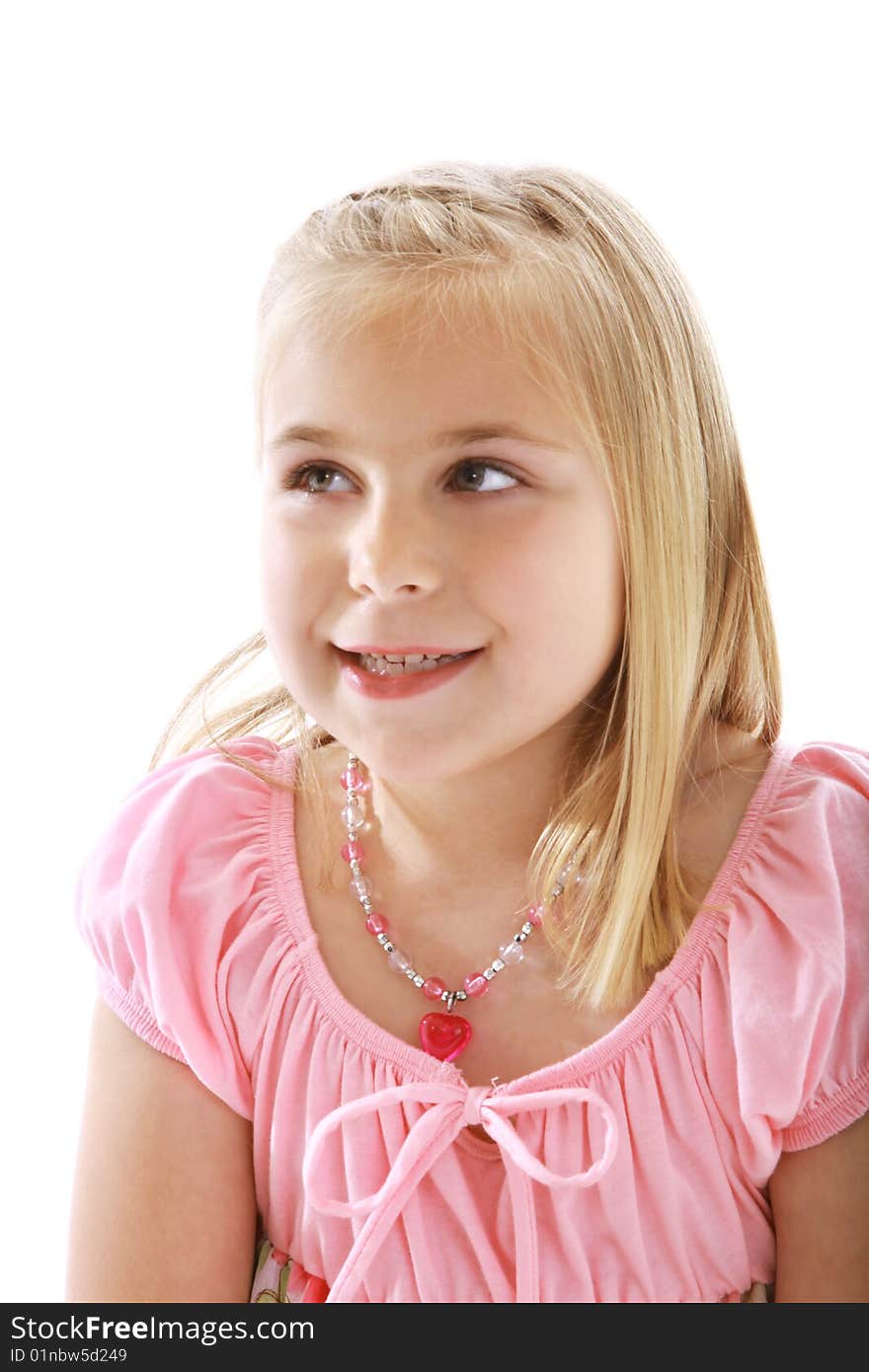 Cute little girl wearing a pink shirt.