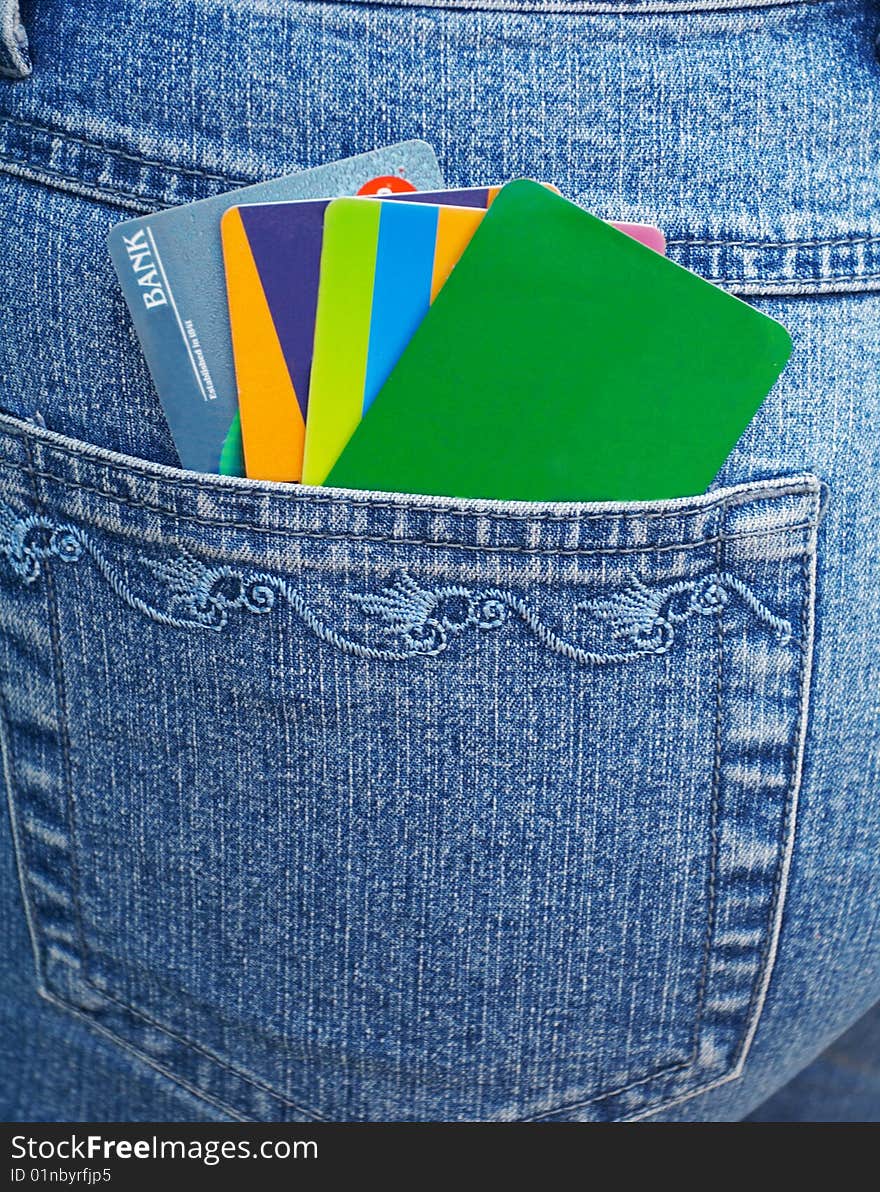 Color banking cards and  blue jeans