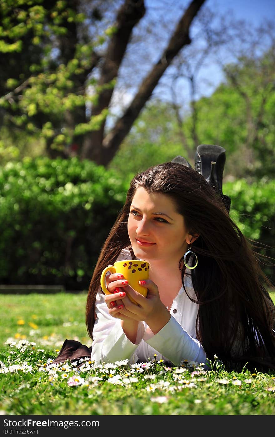 Young girl drinking coffee in the early morning