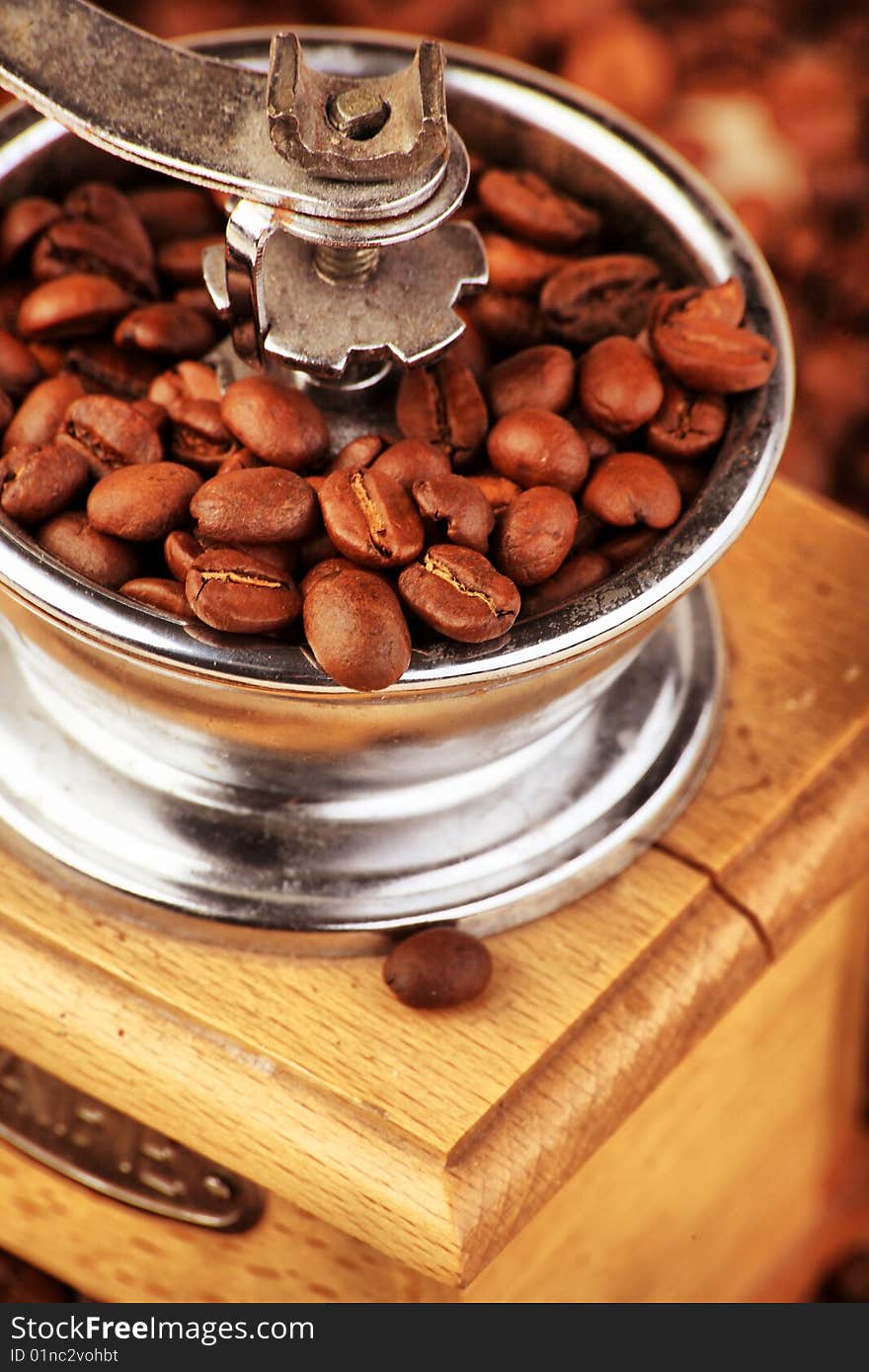 Close-up of  beans and coffee grinder.