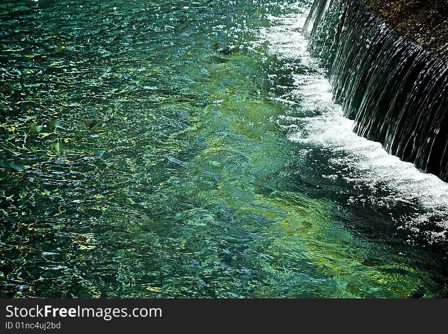 Breathtaking beautiful impressionistic image of waterfall  with a lot of space for copy or graphics