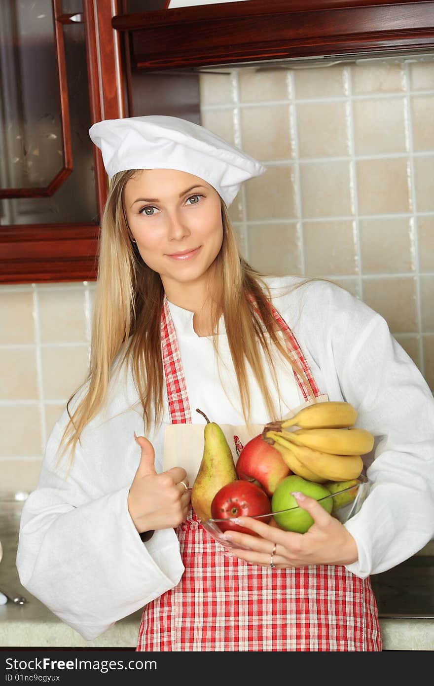 A cook is cooking on a kitchen. A cook is cooking on a kitchen.