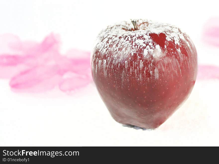 Sweet apple on white background with sugar ans heart. Sweet apple on white background with sugar ans heart.