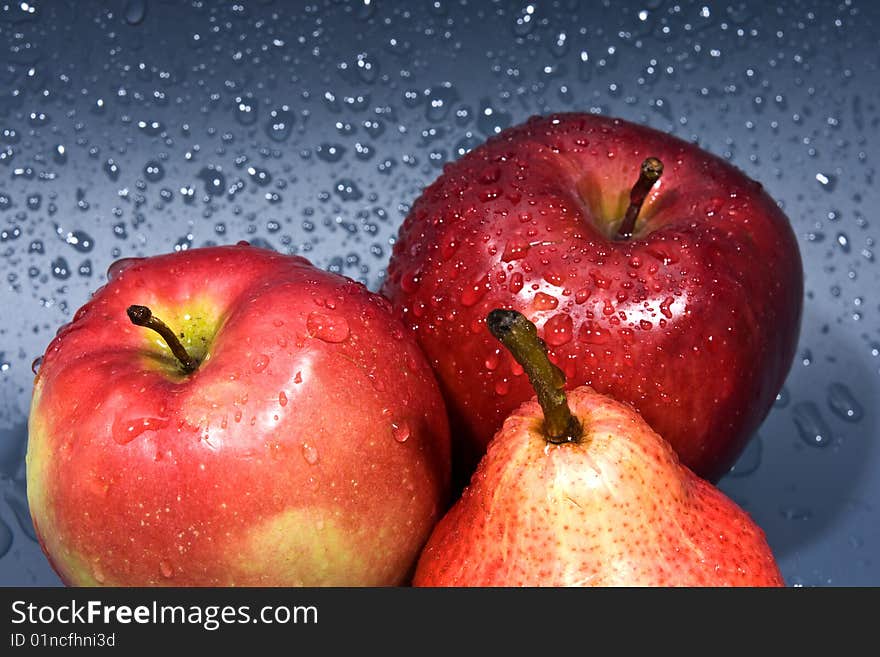 Fruit, are photographed on a grey wet background. Fruit, are photographed on a grey wet background