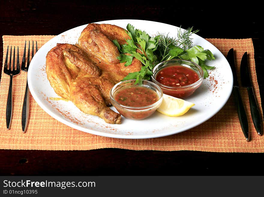 Roasted whole chicken on a plate