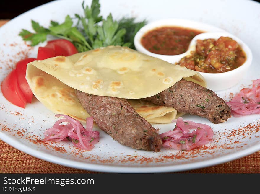 Chops are fried in wheat bread with green-stuffs. Chops are fried in wheat bread with green-stuffs