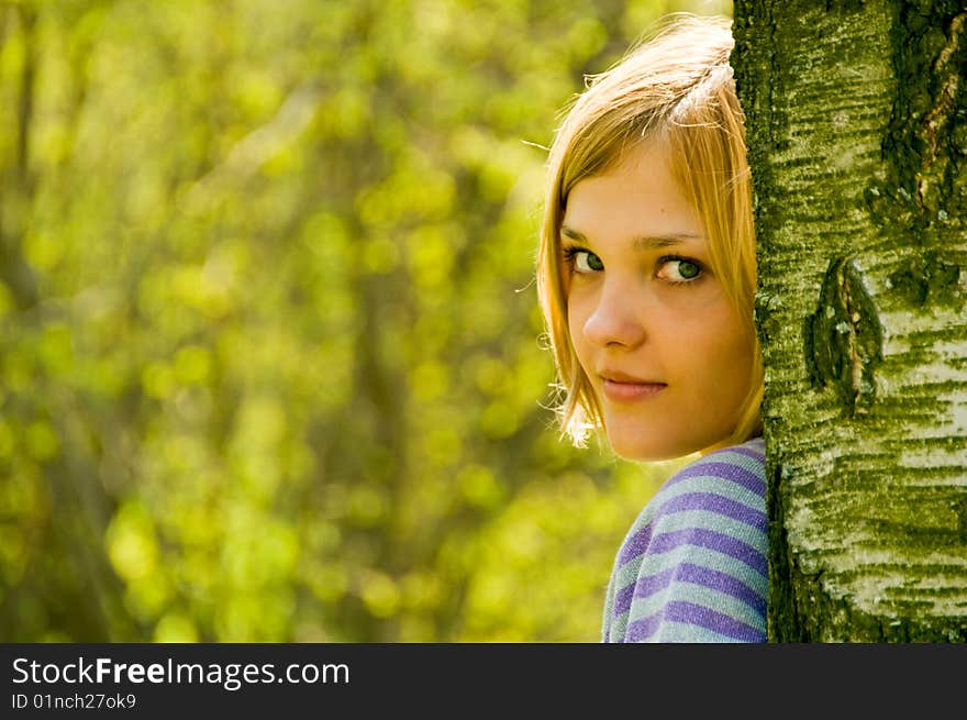 Portrait of young beautiful woman on nature