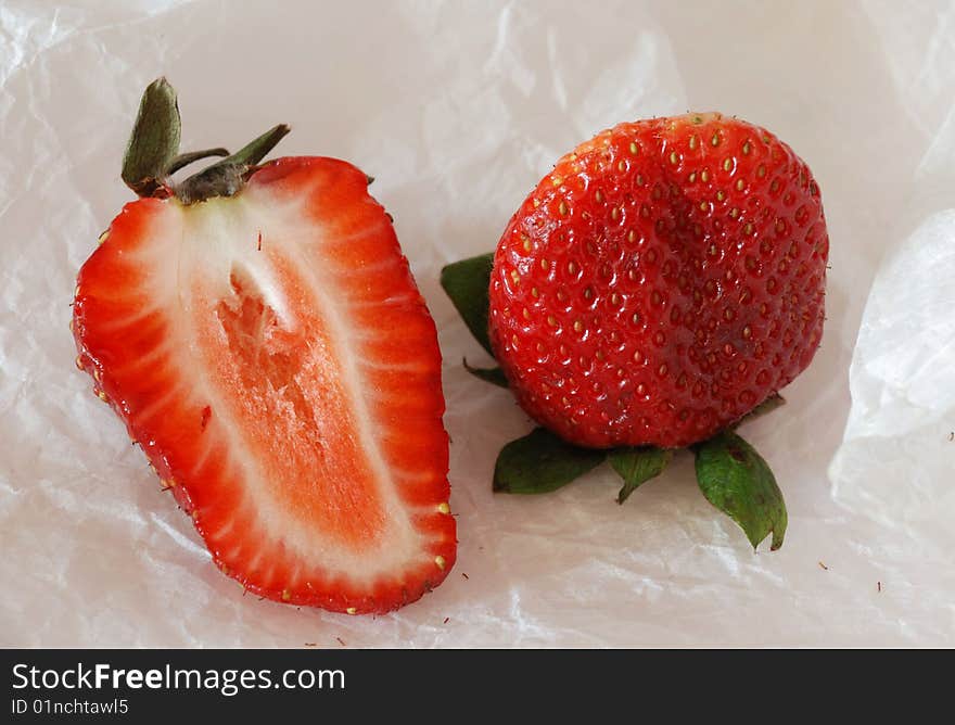 Whole berry of strawberry and its half