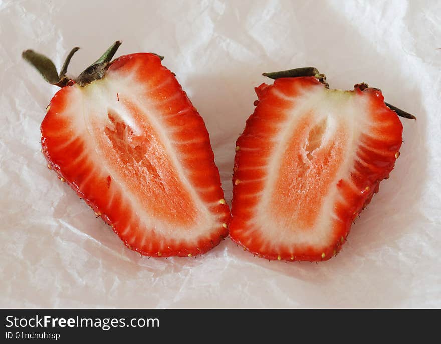 Two halves of the cut strawberry