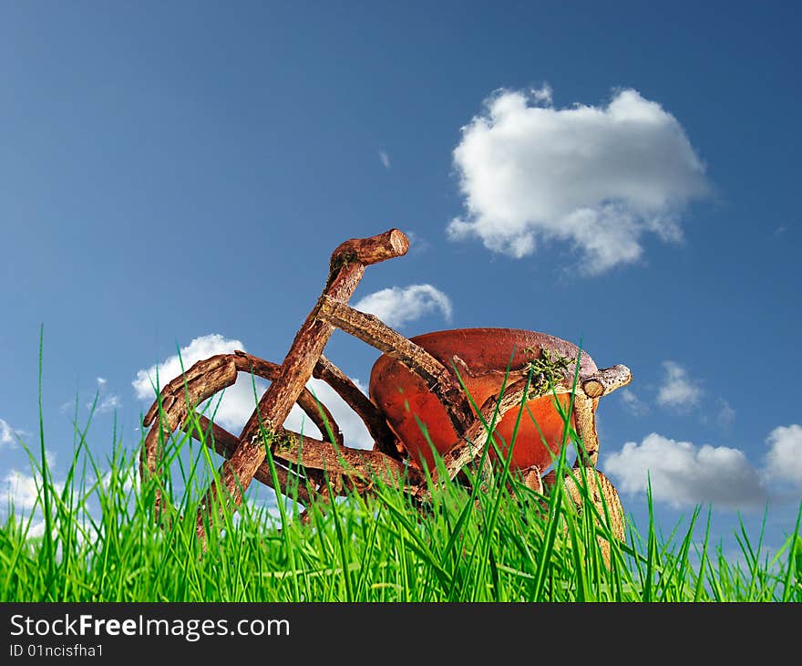 Wood bike with grass in front,blue sky background