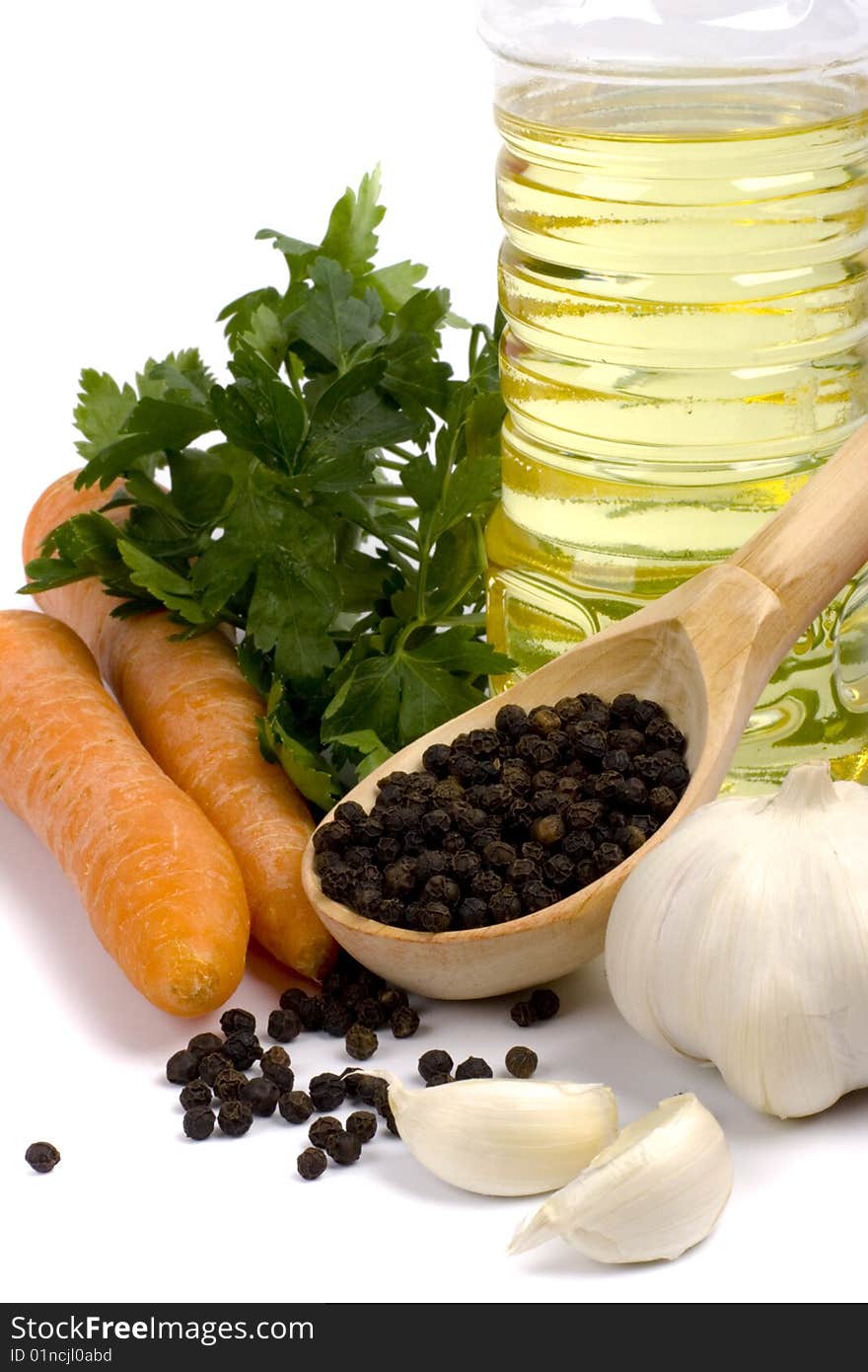 Carrots, parsley, garlic, black pepper and oil closeup. Carrots, parsley, garlic, black pepper and oil closeup