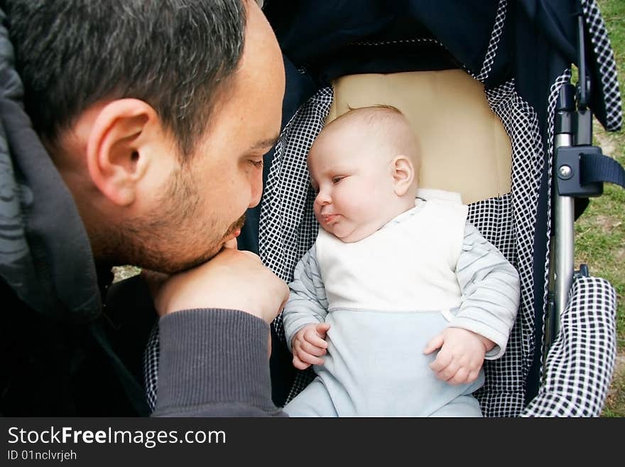 Father and baby looking at each other