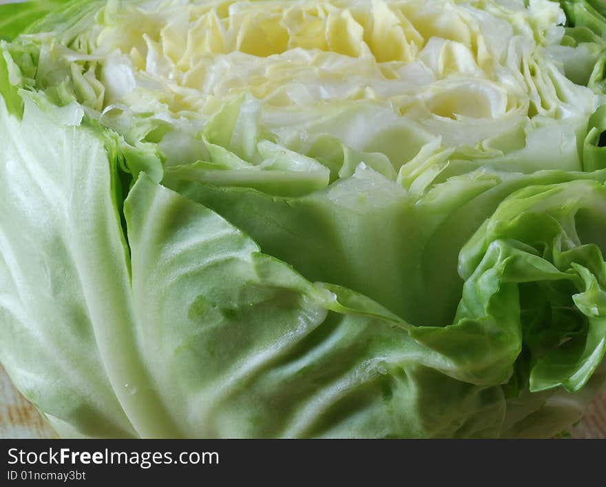 The cut white cabbage lies on a table