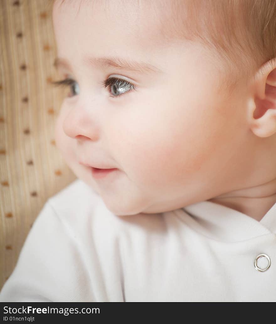 Portrait of adorable blue-eyes baby. Face close-up