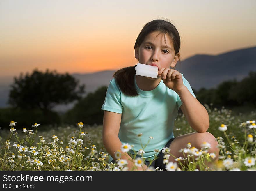 Young girl having a popsicle