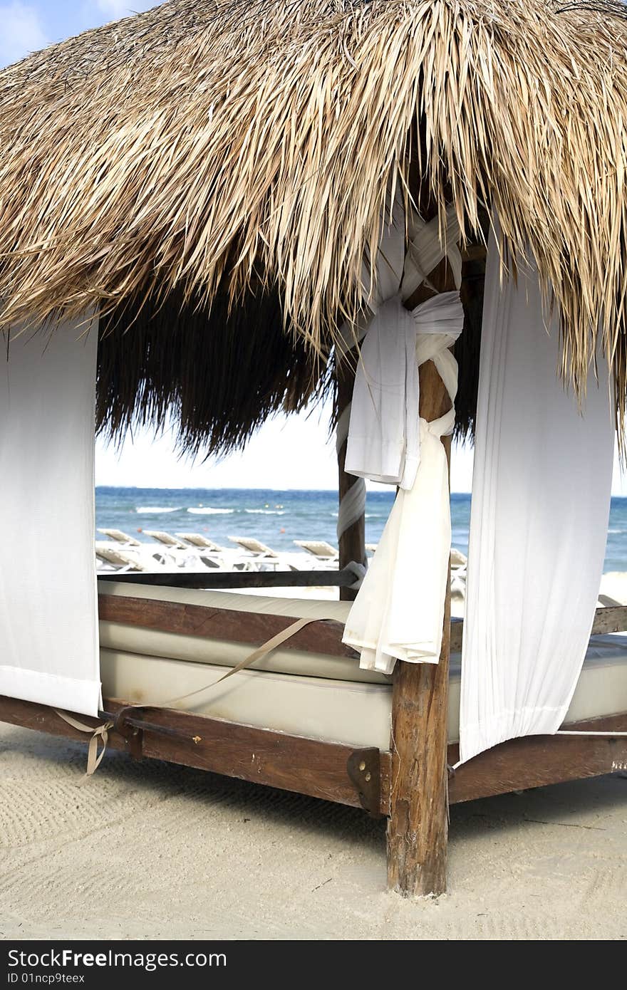 Image beach gazebo with ocean and blue skies in the background