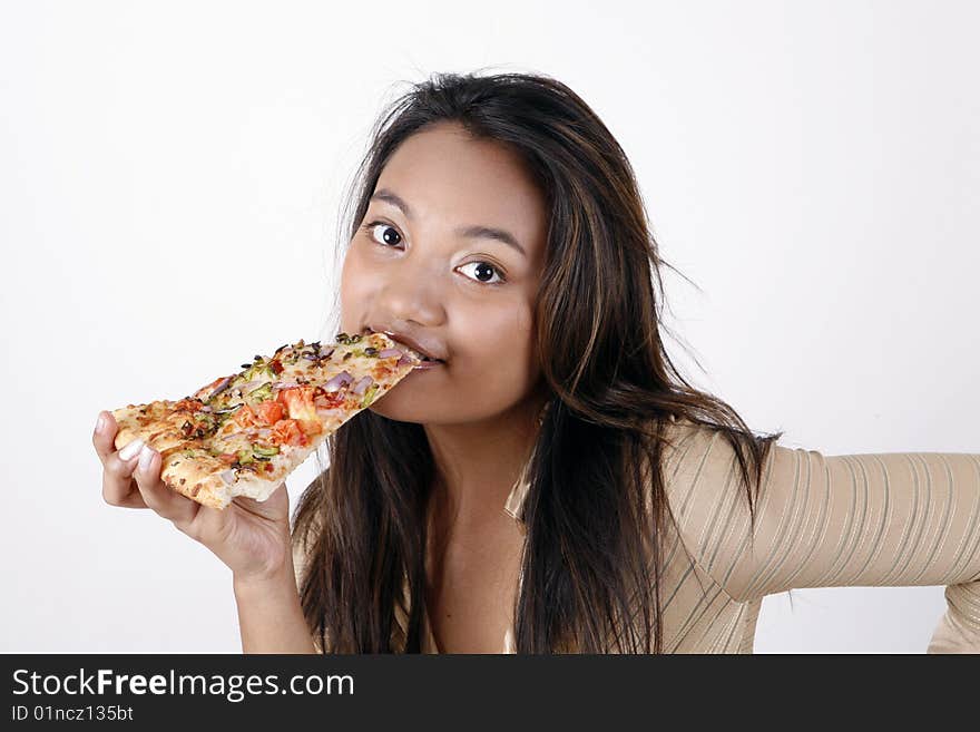 Girl eating pizza slice