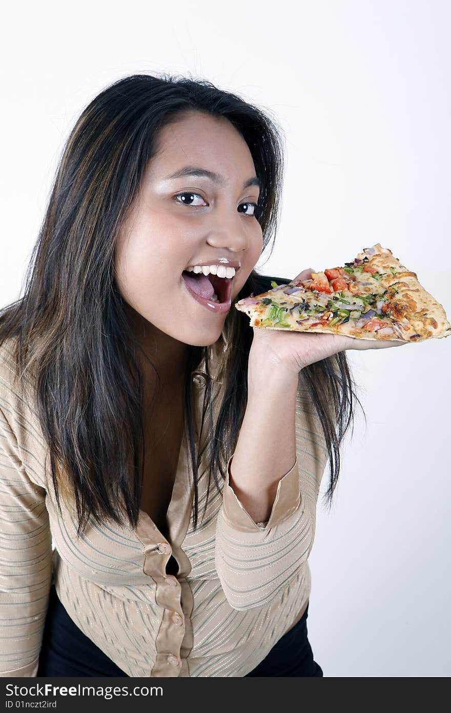 Sweet and pretty girl eating pizza slice