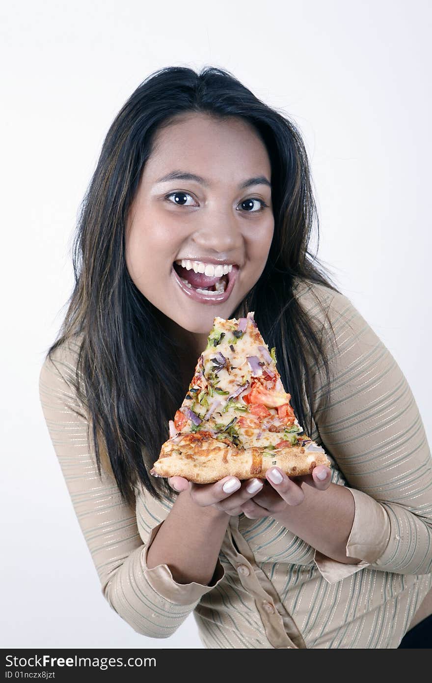 Sweet and pretty girl eating pizza slice