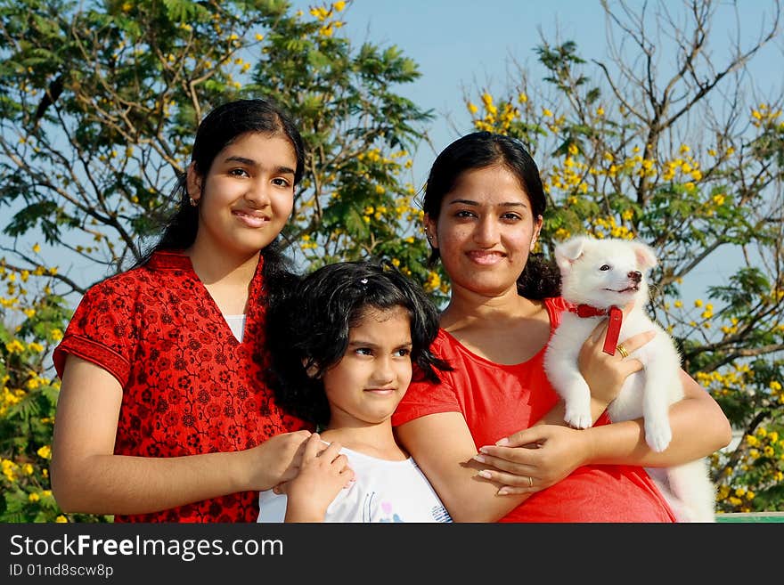 Three girls and dog