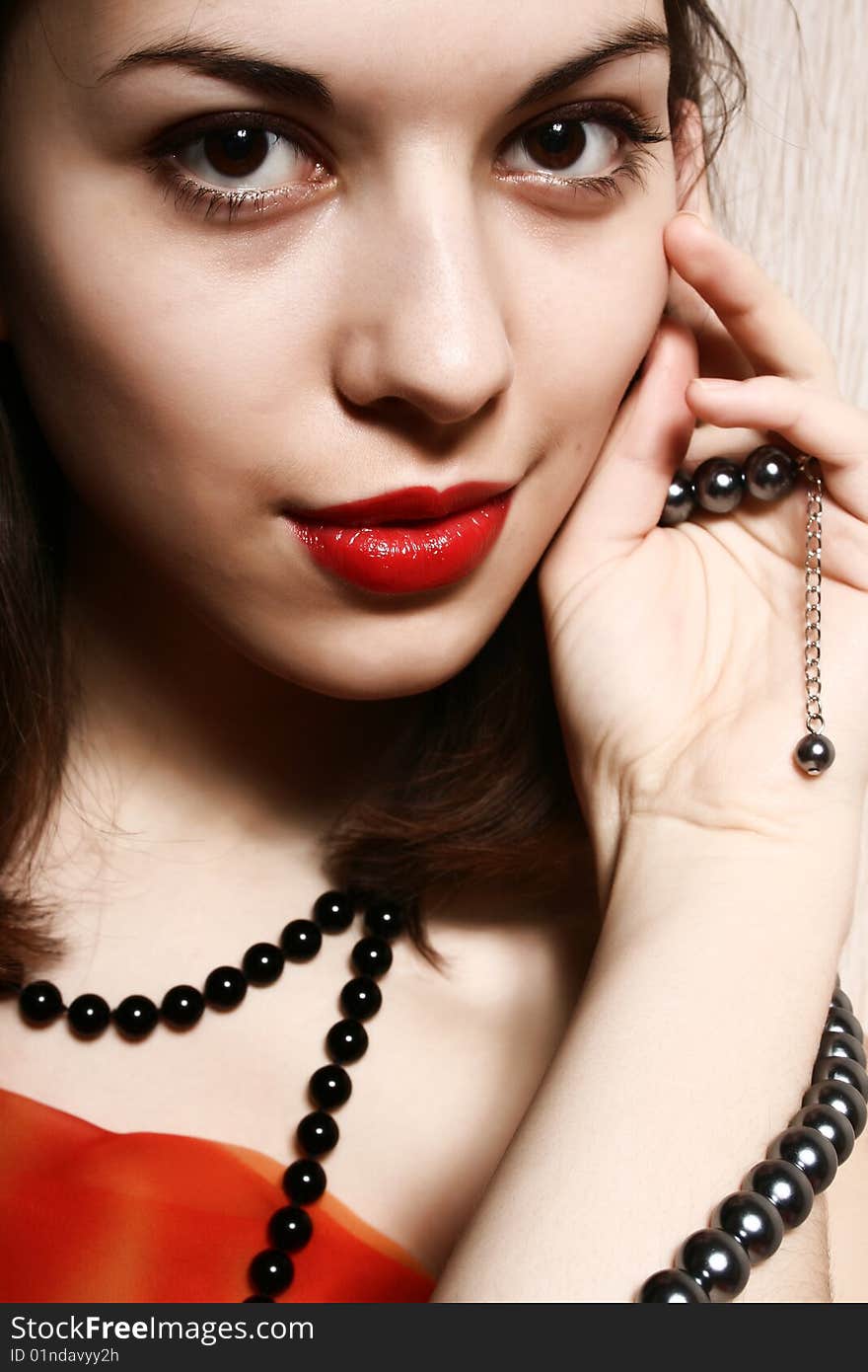 Beads and red lips.