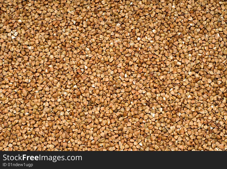 Buckwheat brown  background, close-up, cooking ingredients. Buckwheat brown  background, close-up, cooking ingredients