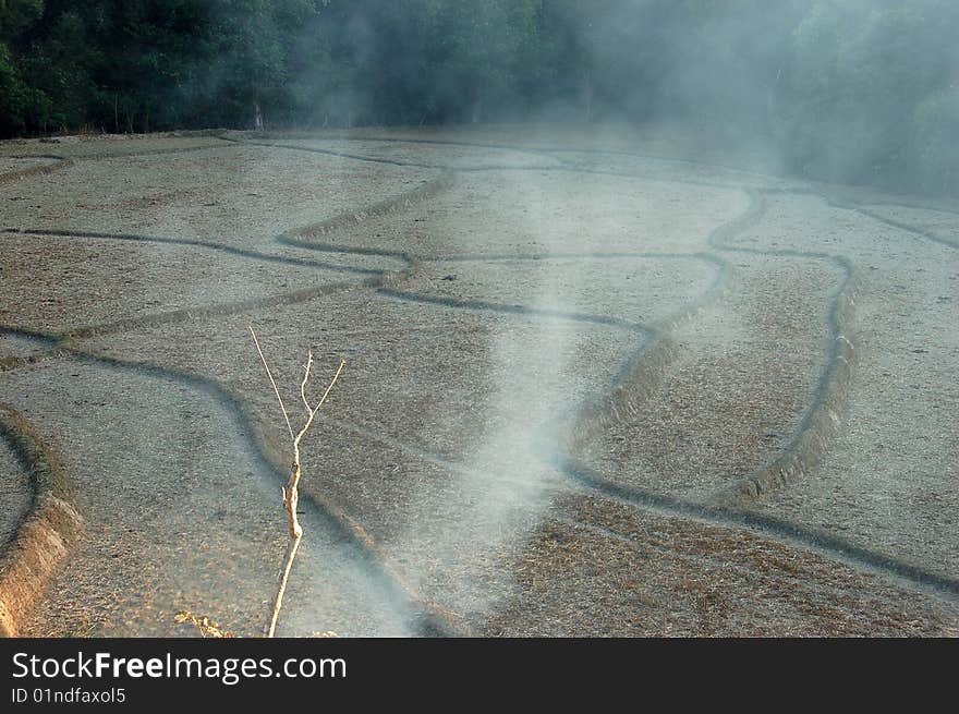 Smoking dry rice field in Thailand