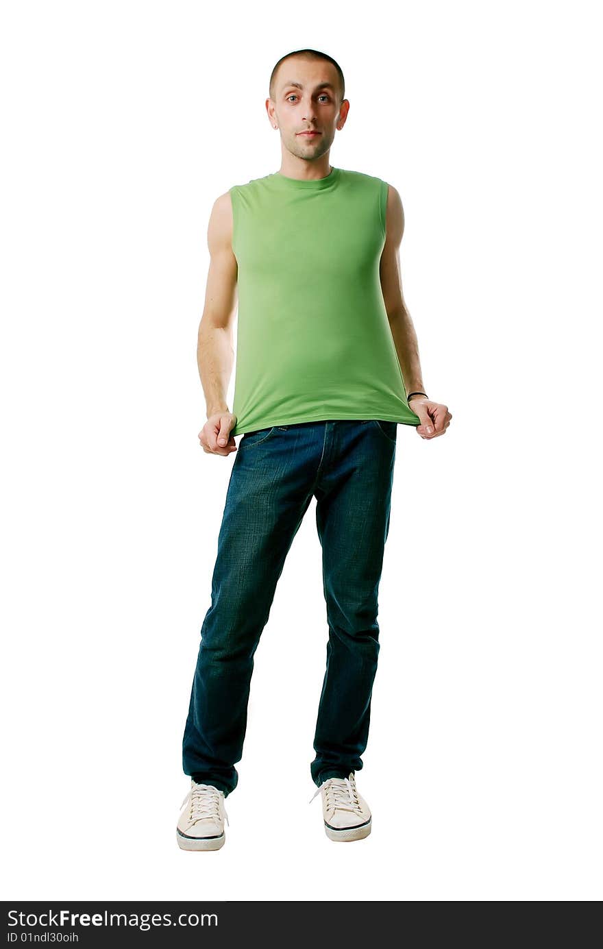 A happy young man in jeans and a shirt on a white background