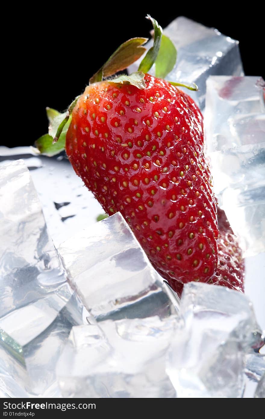 Juicy strawberry with ice cubes