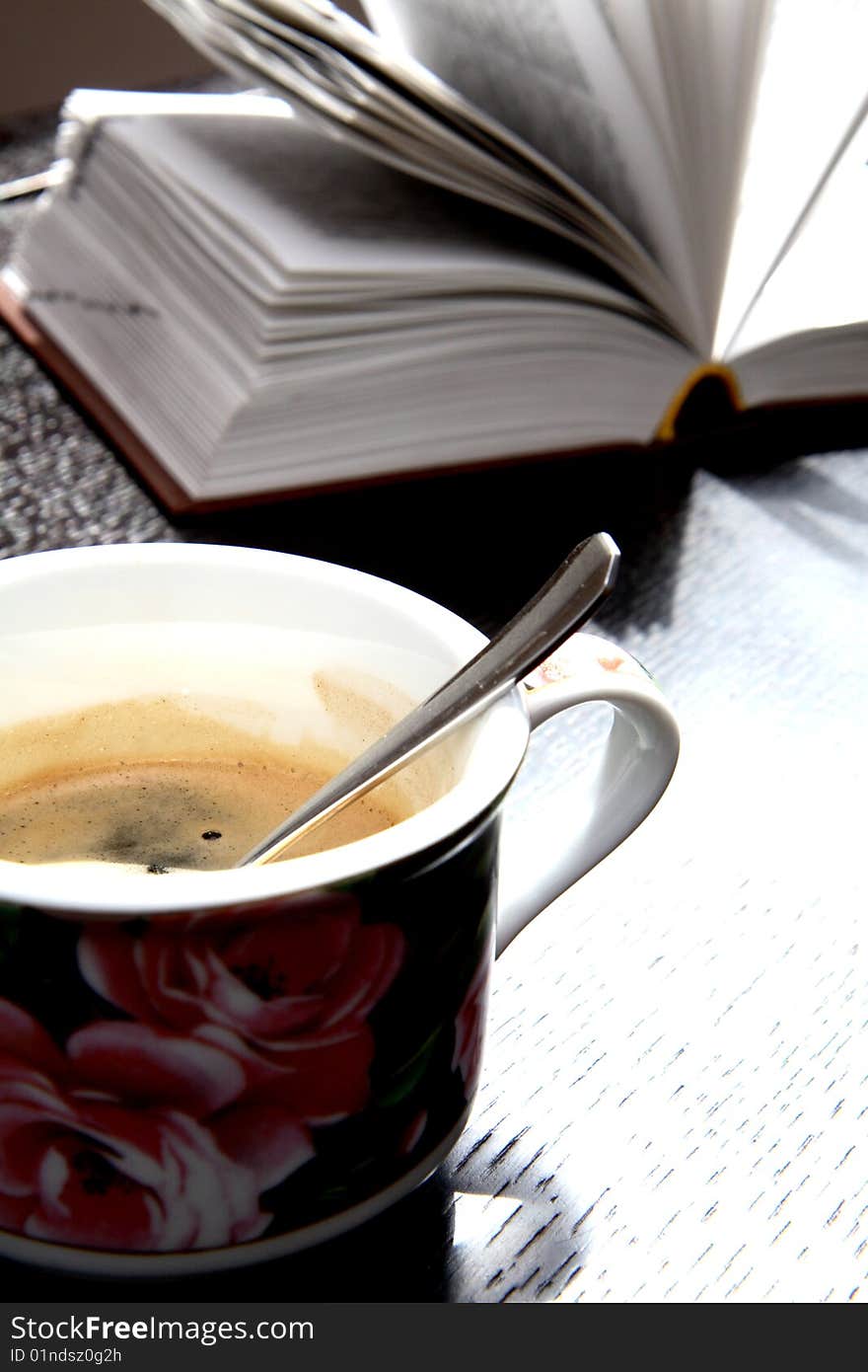 Coffee and book on the table