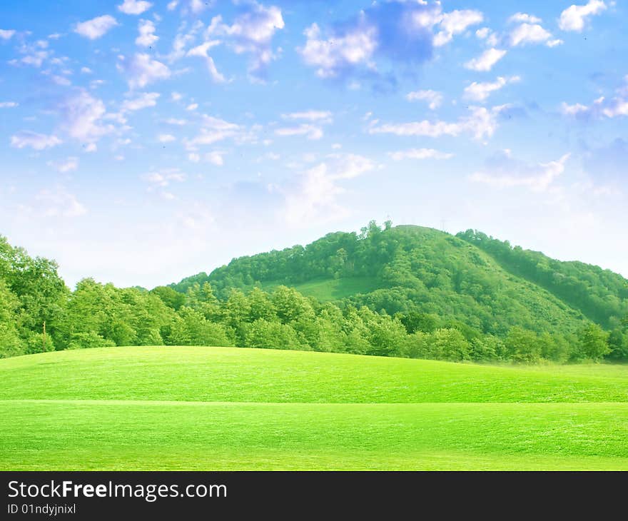 Abstract scene green tree on meadow under blue sparkling sky