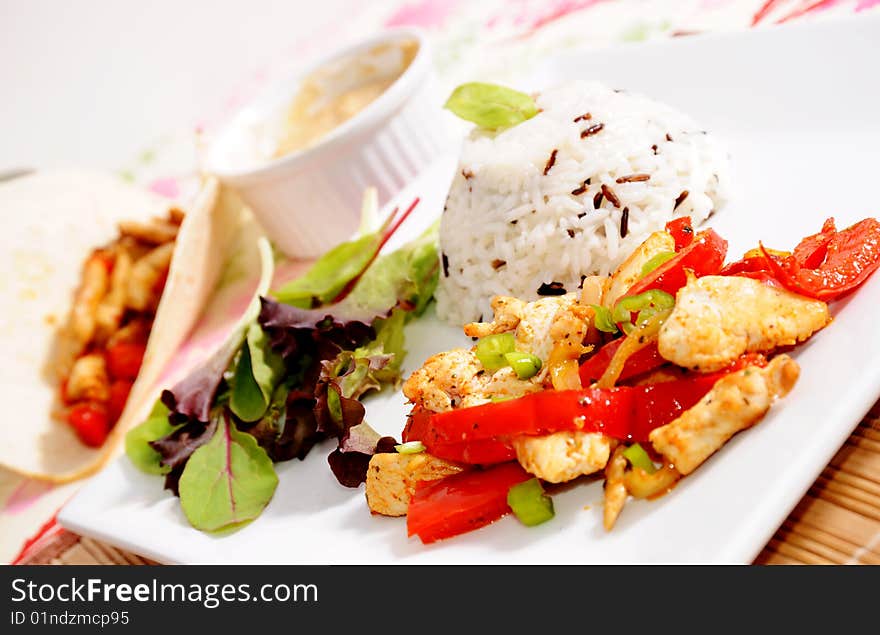 Texmex grilled chicken breast with peppers and onions - rice on side. Texmex grilled chicken breast with peppers and onions - rice on side