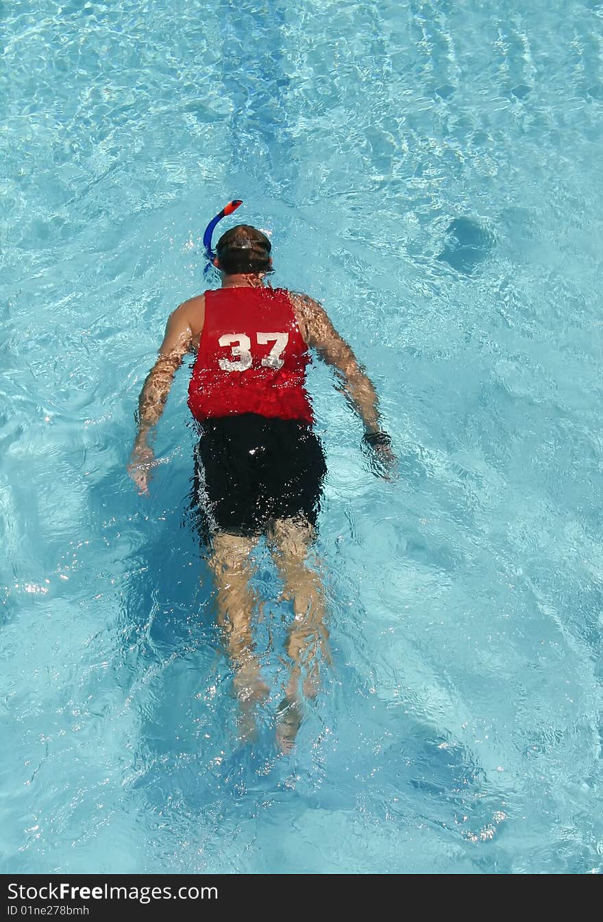 Man swimming in a pool