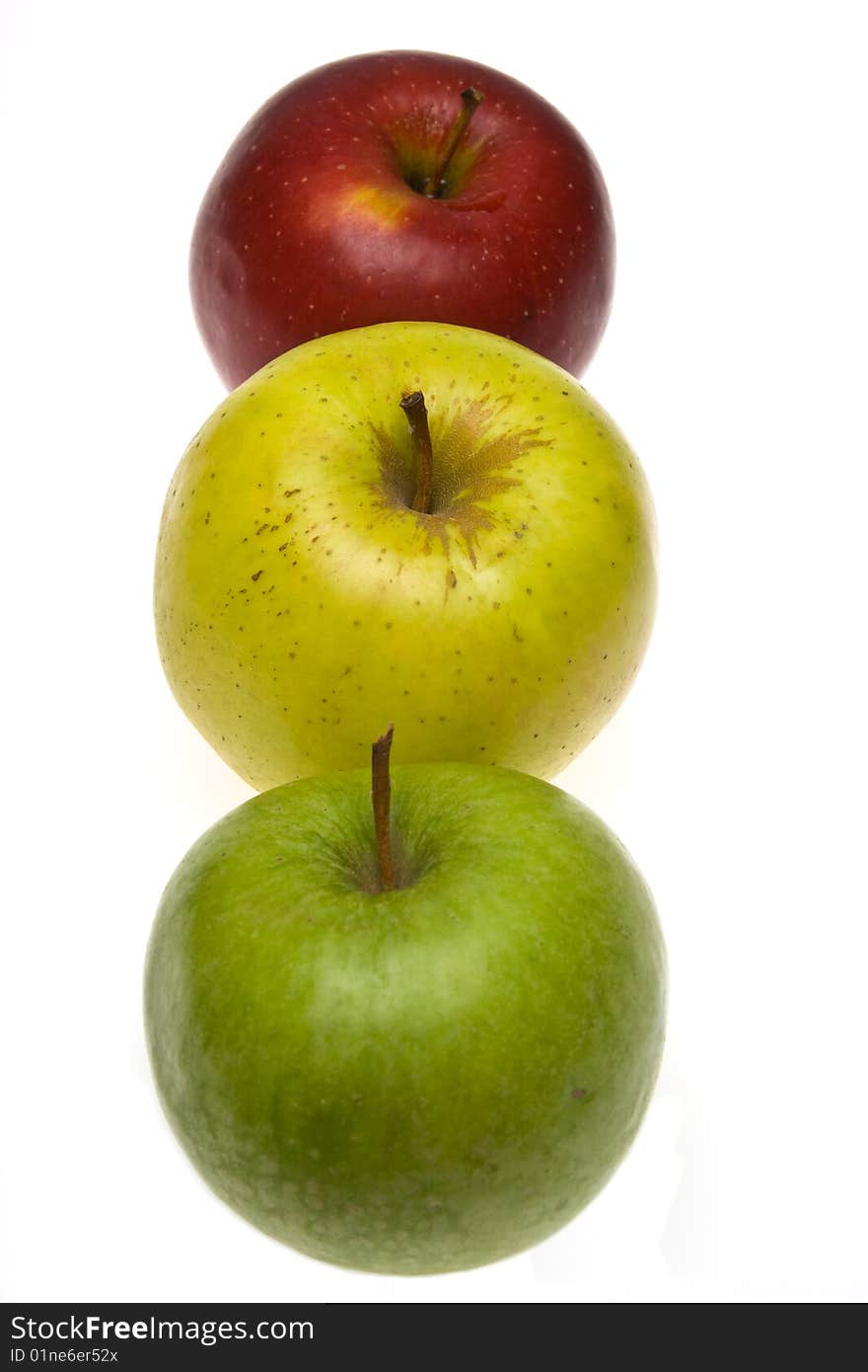 Three apples, are photographed on a white background. Three apples, are photographed on a white background