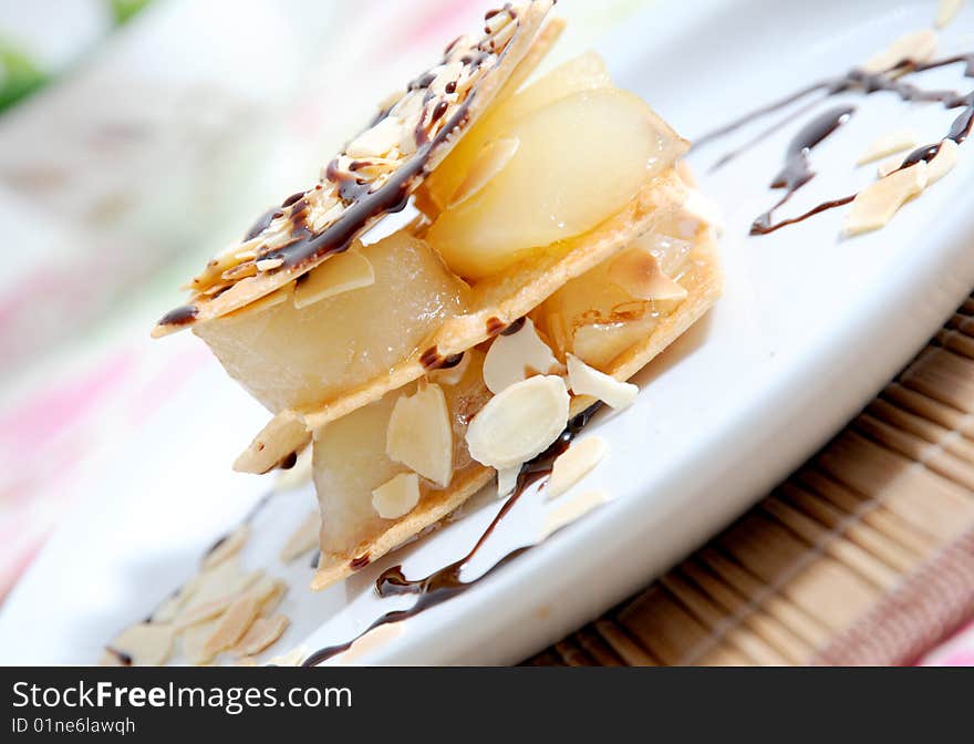 Pastry with caramel pears and almonds with chocolate. Pastry with caramel pears and almonds with chocolate