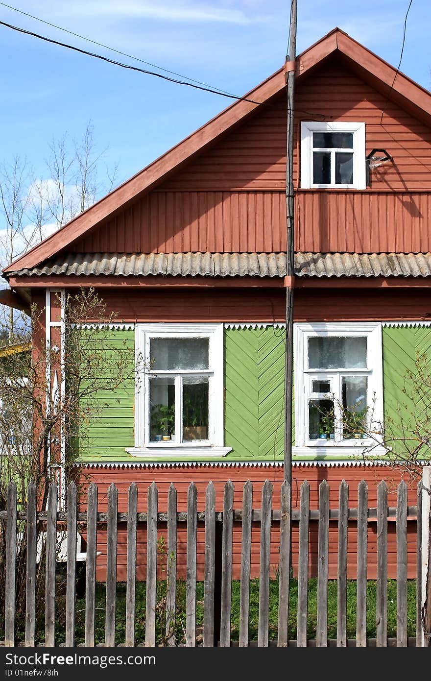 Old-style Russian wooden village house or izba in the countryside. Old-style Russian wooden village house or izba in the countryside