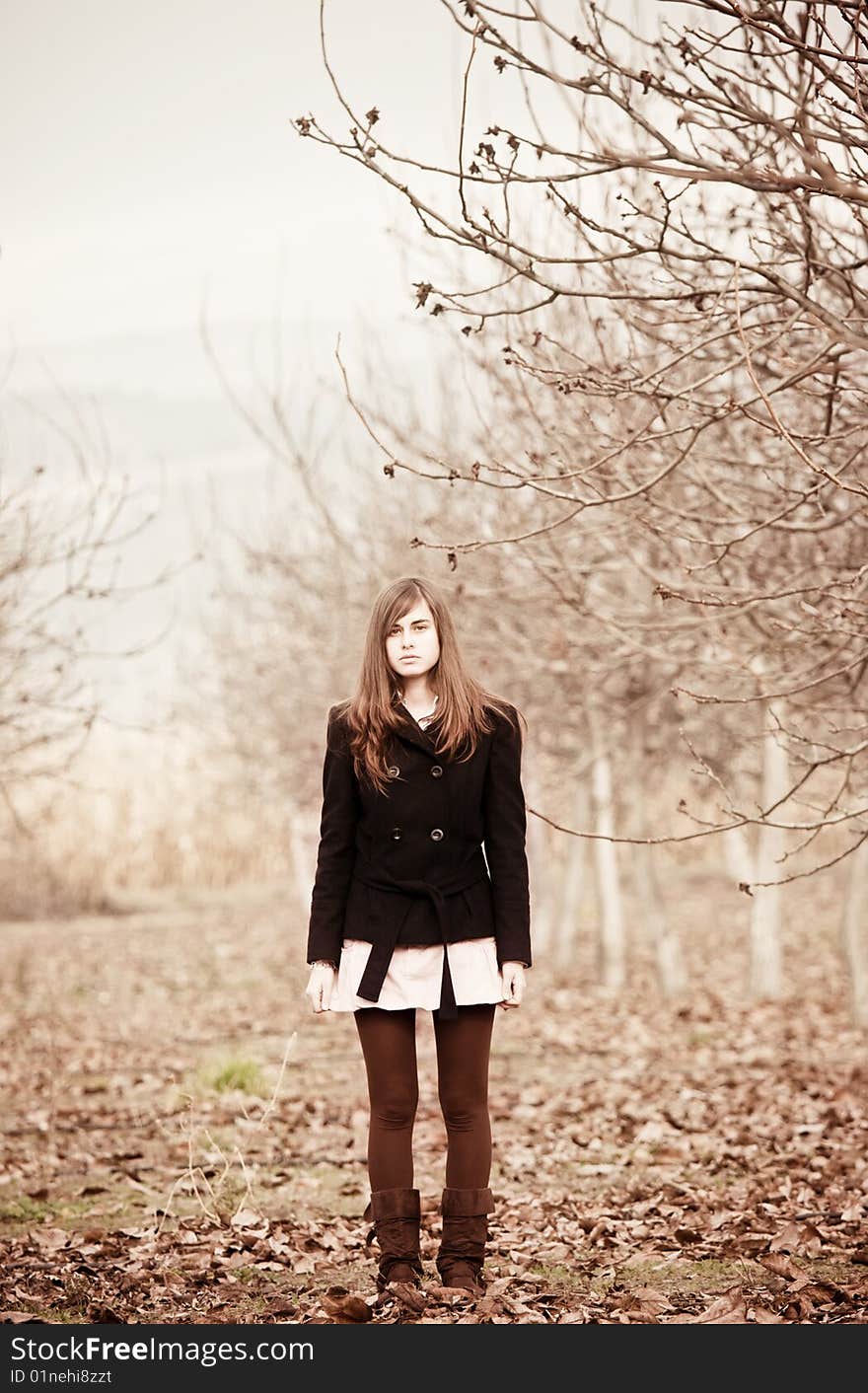 Young lone girl staring at camera. Young lone girl staring at camera.