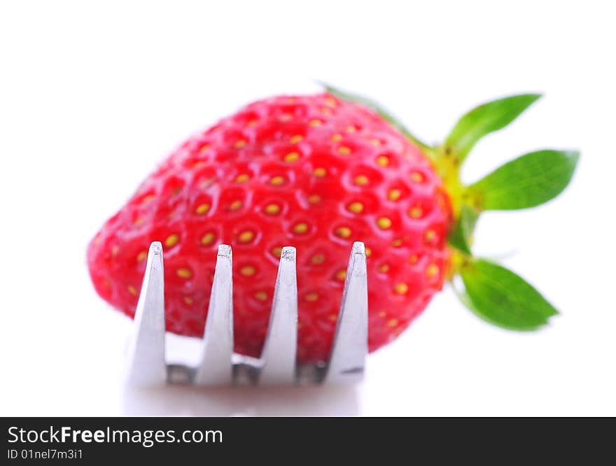 A strawberry on a fork