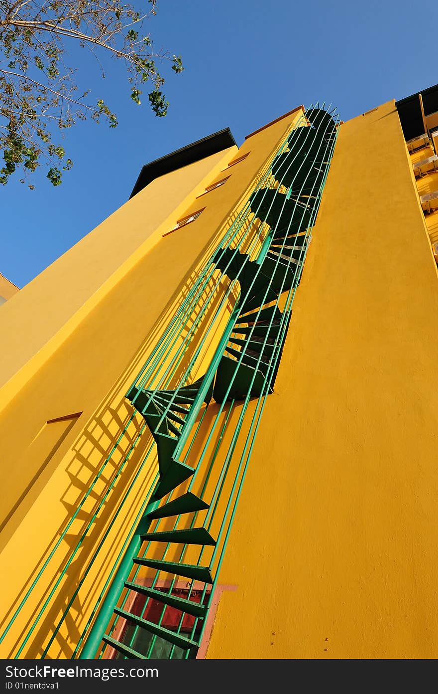 External fire escape on a yellow wall