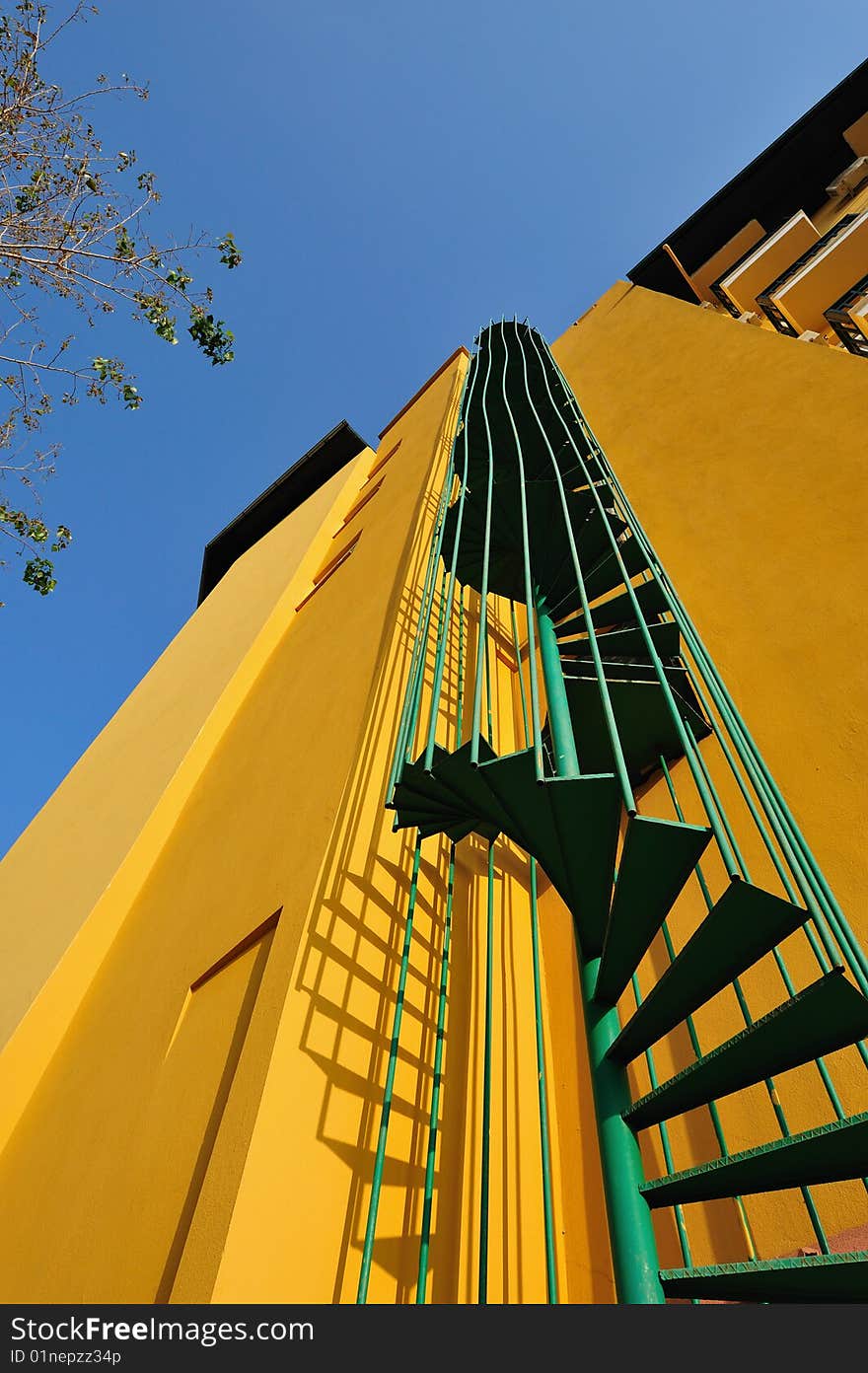 External fire escape on a yellow wall