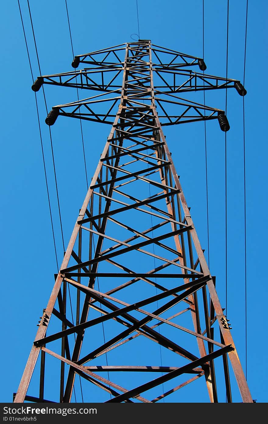 Electrical tower on a background of the blue sky