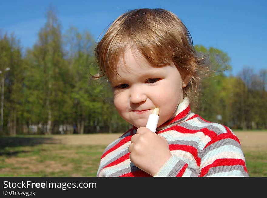 The Little Girl Does A Make Up Of Lips